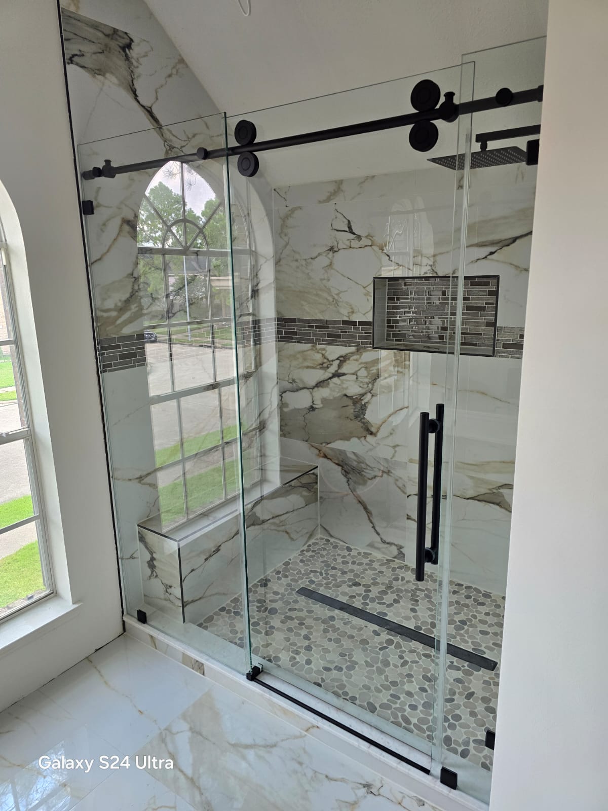 Glass Shower with Marble Walls